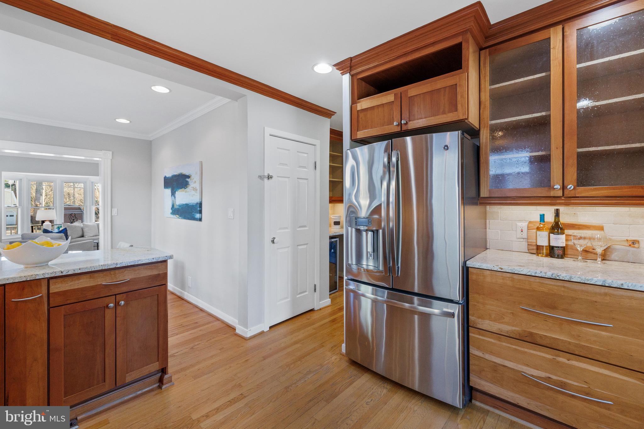 202 Russell Road Alexandria, VA 22301 - Photo 22 of 70 a kitchen with stainless steel appliances granite countertop a refrigerator and a sink