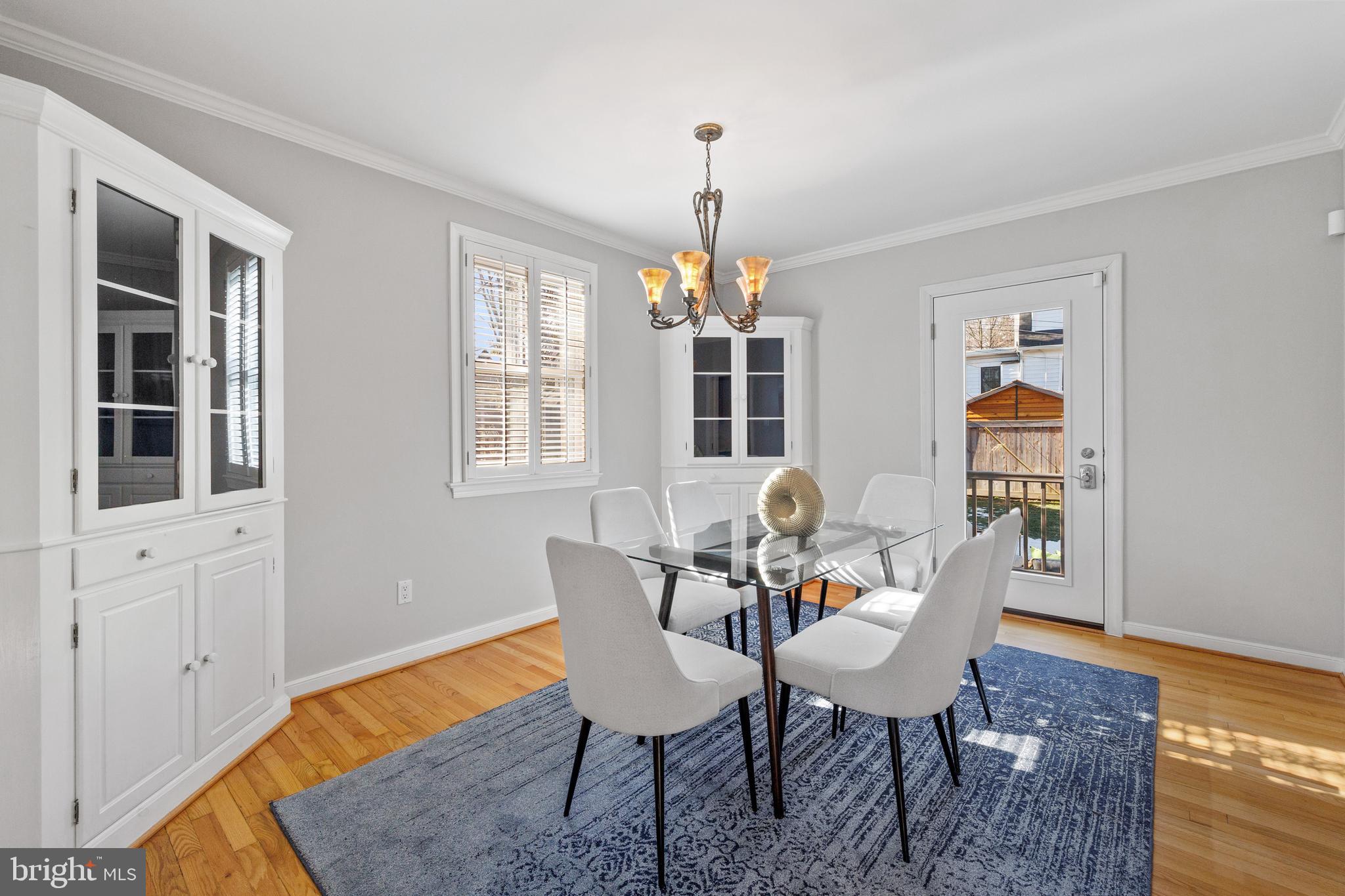 202 Russell Road Alexandria, VA 22301 - Photo 24 of 70 a dining room with furniture a rug and wooden floor