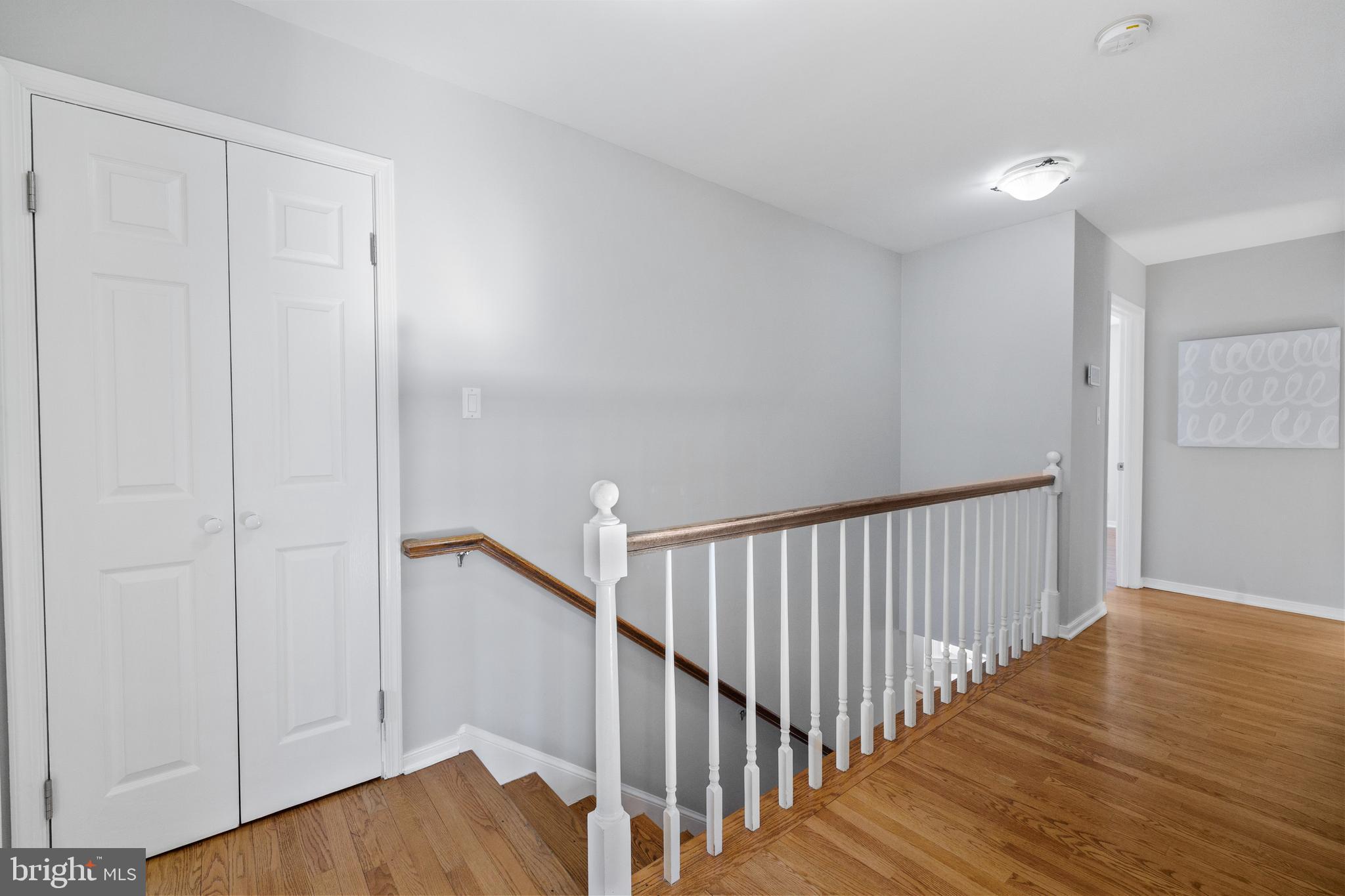 202 Russell Road Alexandria, VA 22301 - Photo 27 of 70 a view of a hallway with wooden floor