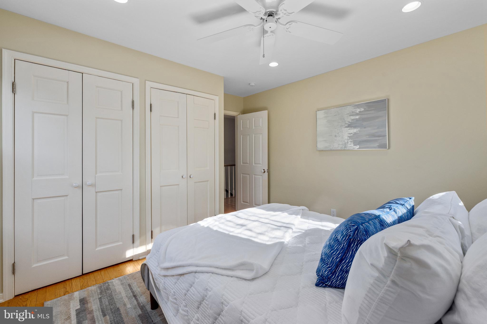 202 Russell Road Alexandria, VA 22301 - Photo 45 of 70 a bedroom with a bed and a chandelier