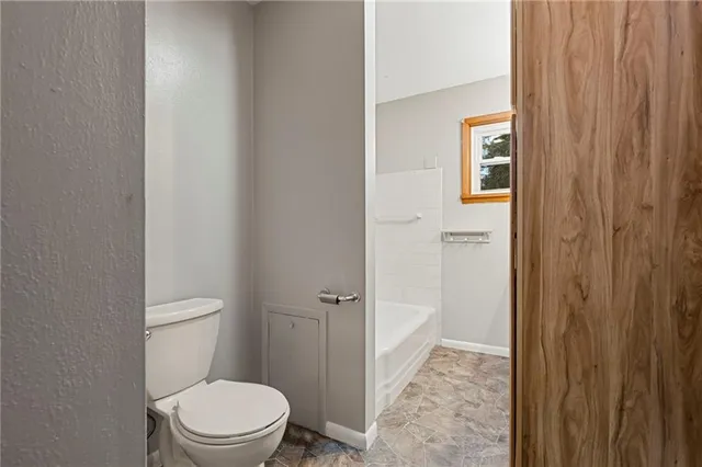 a bathroom with a toilet