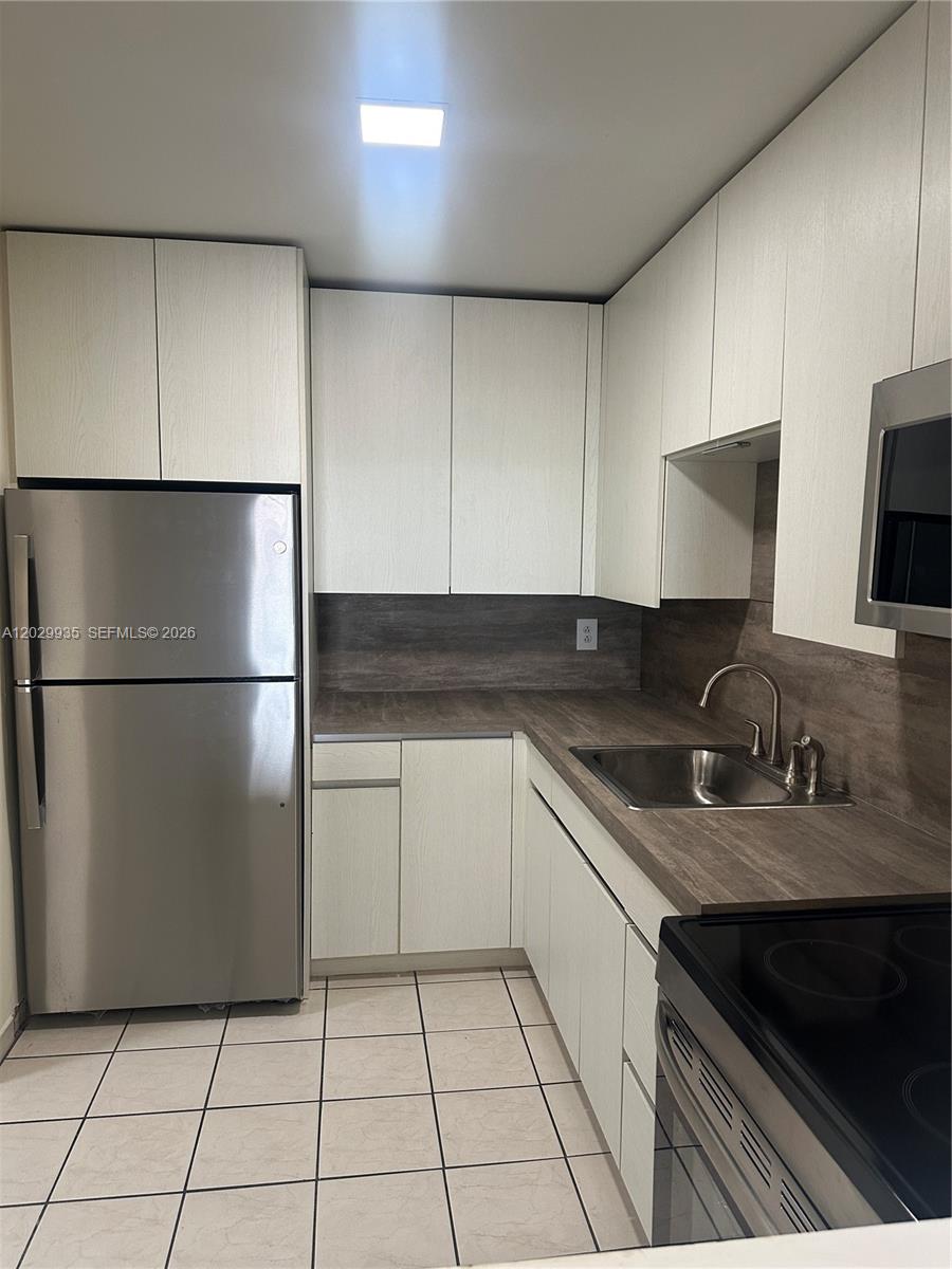 1075 West 68th Street, Unit 309 Hialeah, FL 33014 - Photo 1 of 13