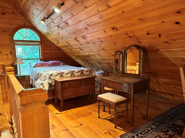 a bathroom with a toilet and a shower curtain