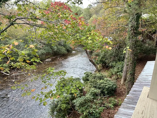 a view of a backyard with sitting area