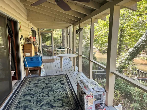 a living room with a rug and a fireplace