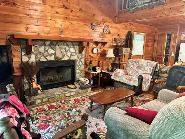 a outdoor living space with furniture and a fireplace