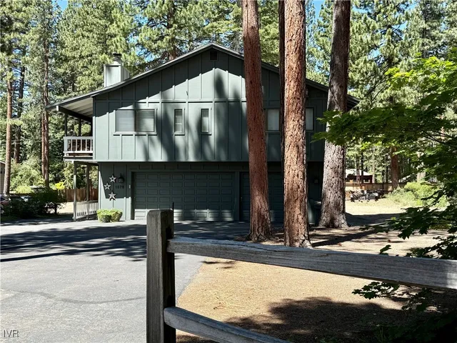 a house with trees in the background