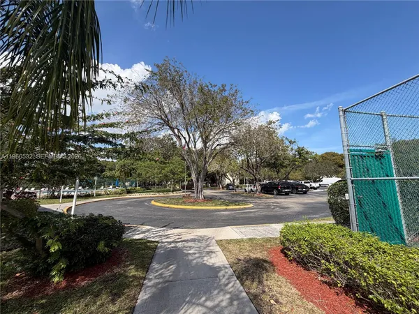 a view of a yard and basketball court