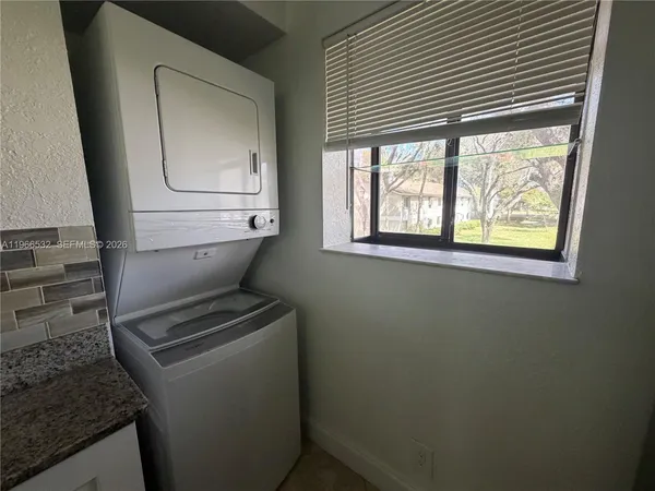 a bathroom with a toilet sink and window