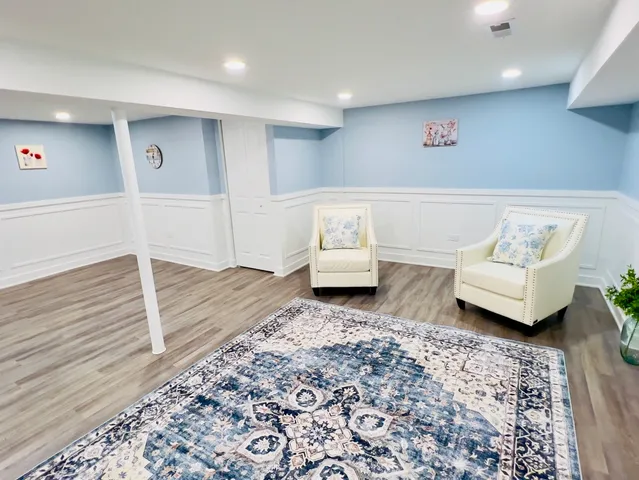 a living room with furniture and a rug