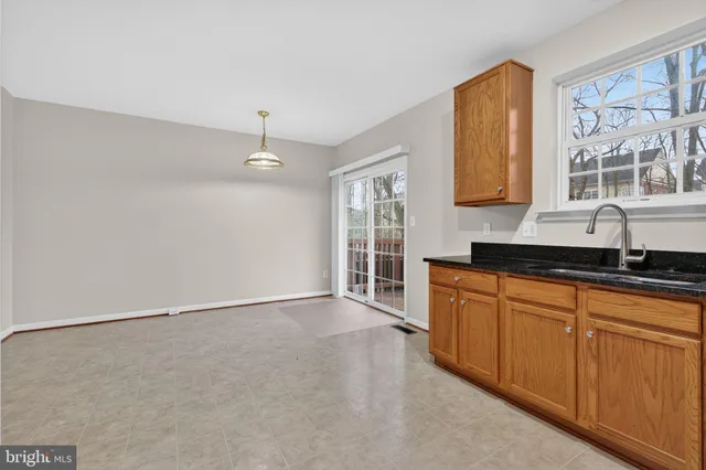 a view of a kitchen with granite countertop cabinets and a sink