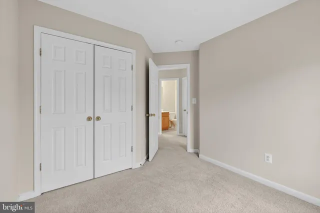 a view of a hallway with closet area