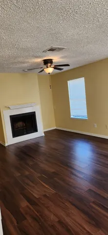 a view of outdoor space with wooden floor