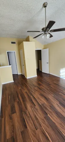 a view of a room with a wooden floor