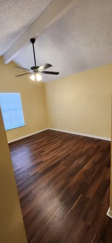 a view of room and wooden floor