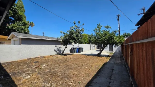 a view of a backyard of the house