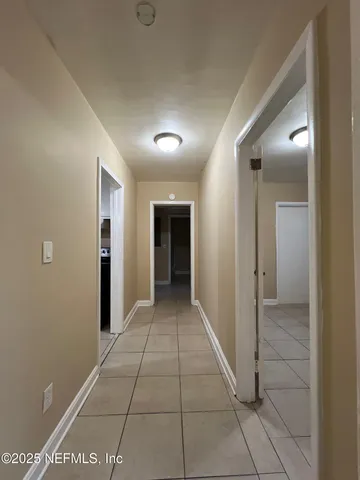 a view of hallway with a hallway and stairs