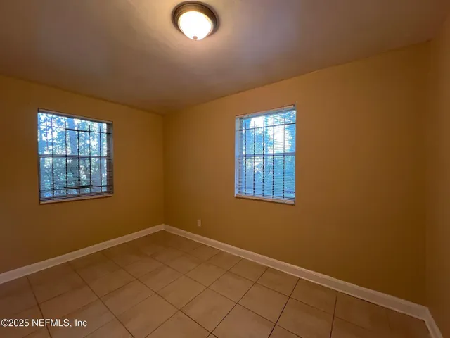 an empty room with windows