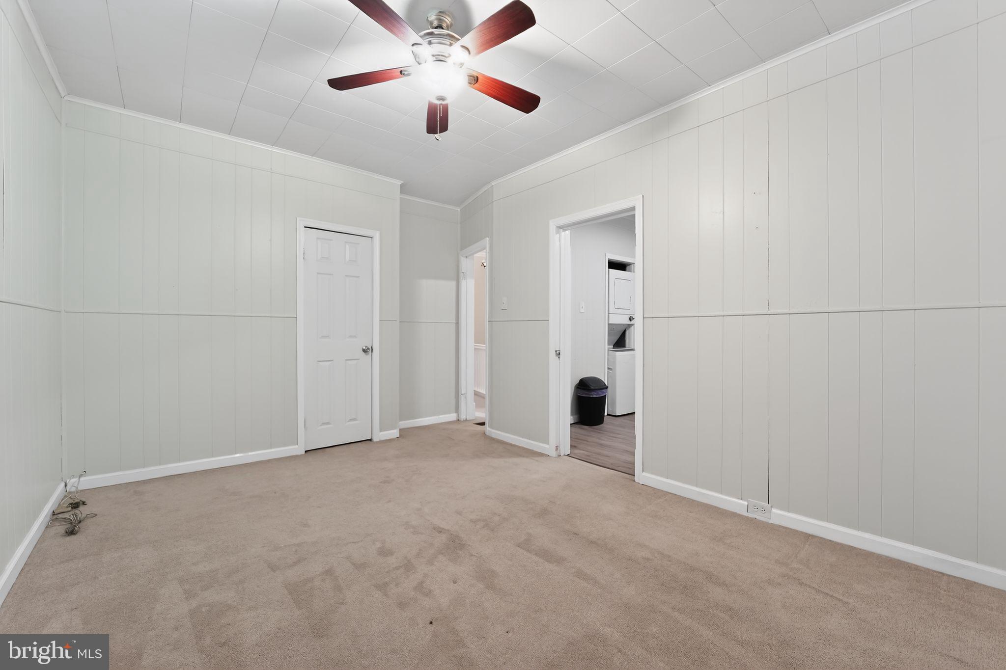 3127 Lawnview Avenue Baltimore, MD 21213 - Photo 11 of 15 an empty room with fan and a ceiling fan