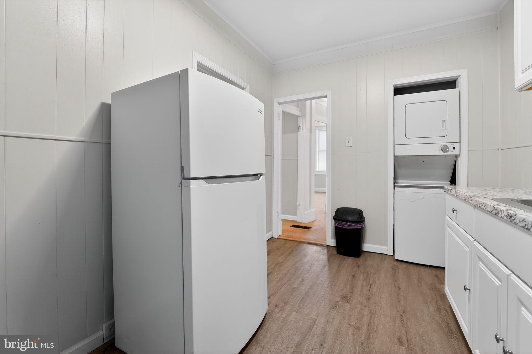 3127 Lawnview Avenue Baltimore, MD 21213 - Photo 4 of 15 a kitchen with a refrigerator and a stove top oven