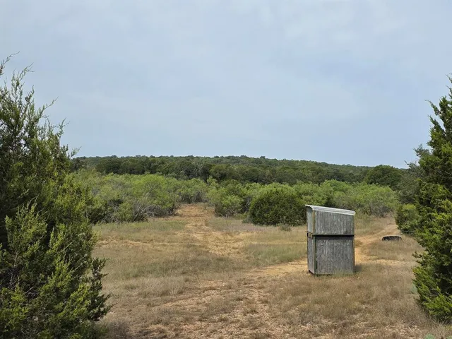 a view of a city with mountains in the background