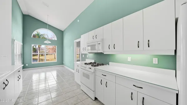 a bathroom with a glass shower door and a glass door