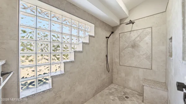 a view of a house with backyard and tree