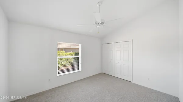 an aerial view of a house with yard swimming pool and outdoor seating
