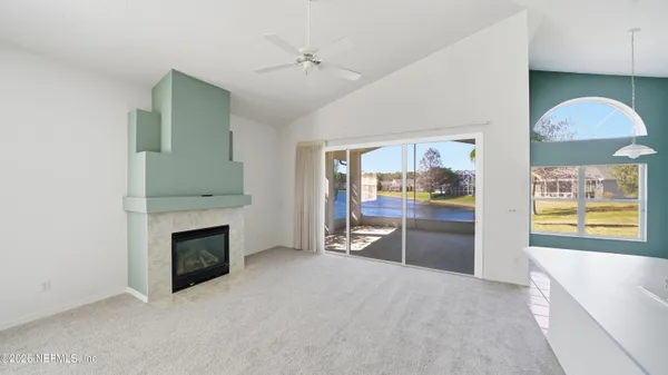 a view of a lake with a palm trees