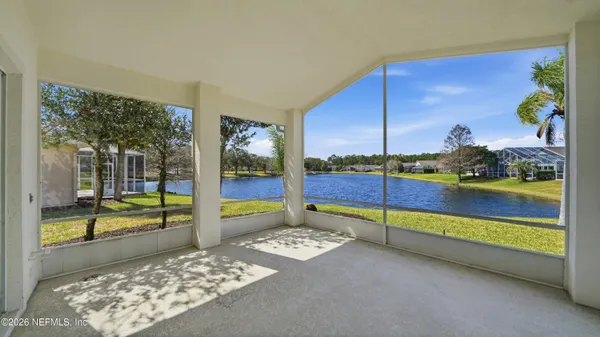 a swimming pool with outdoor seating and yard
