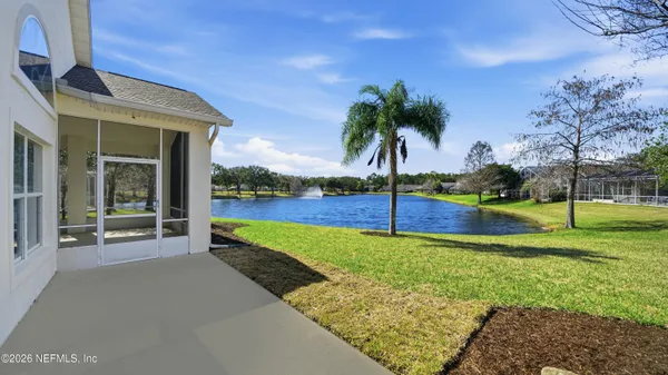 a view of a swimming pool with outdoor seating and city view