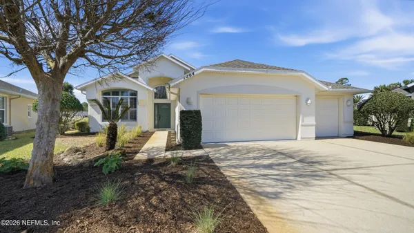 a bedroom with furniture and a chair