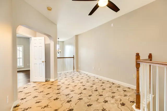 a bedroom with a bed and a view of bathroom