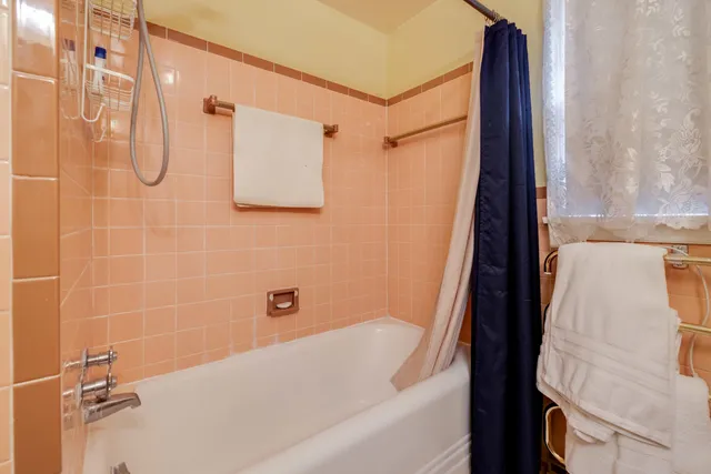 a view of a street with potted plants