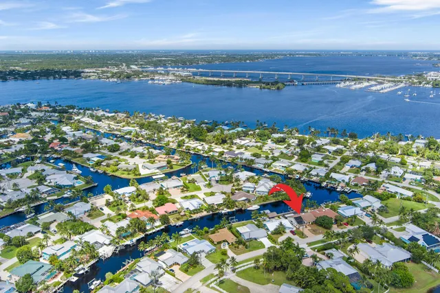 an aerial view of a houses with a lake view
