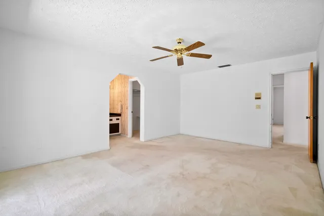 a white toilet sitting next to a bathroom