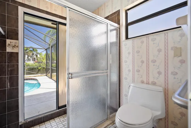 a spacious bedroom with a bed and a window