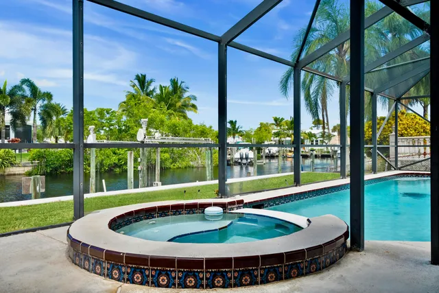 a swimming pool with an outdoor seating