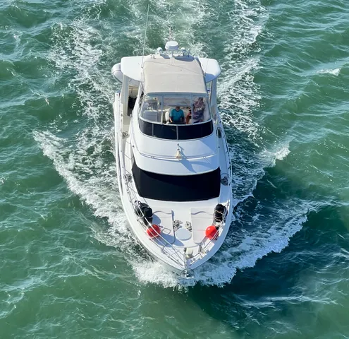 a view of a wooden house with a yard