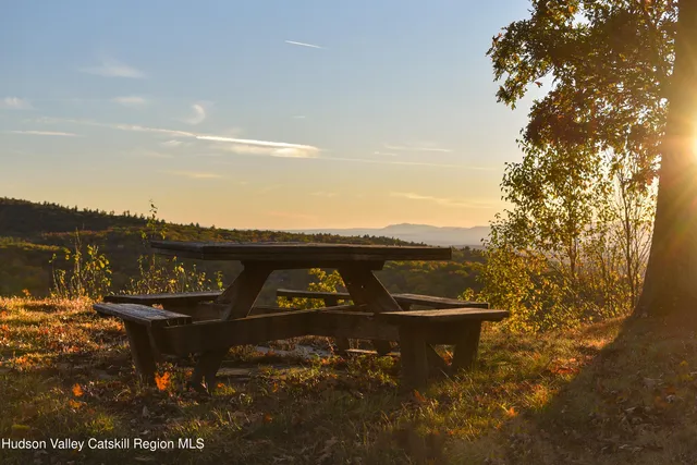 a view of a water fountain and an outdoor seating