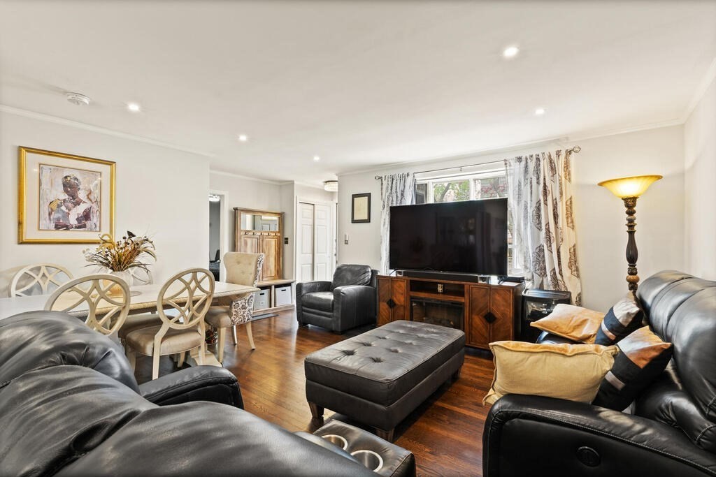36 Violet Street Boston, MA 02126 - Photo 11 of 35 a living room with furniture and a flat screen tv