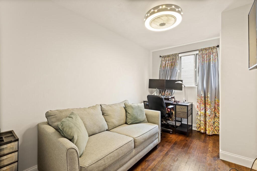36 Violet Street Boston, MA 02126 - Photo 18 of 35 a living room with furniture and a window