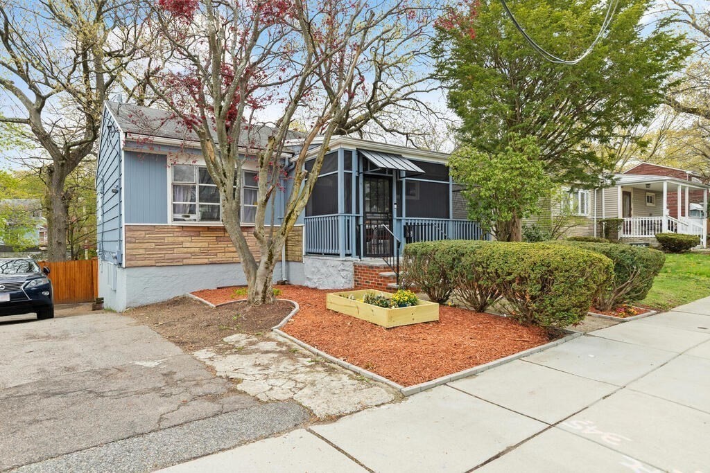 36 Violet Street Boston, MA 02126 - Photo 2 of 35 a front view of a house with garden
