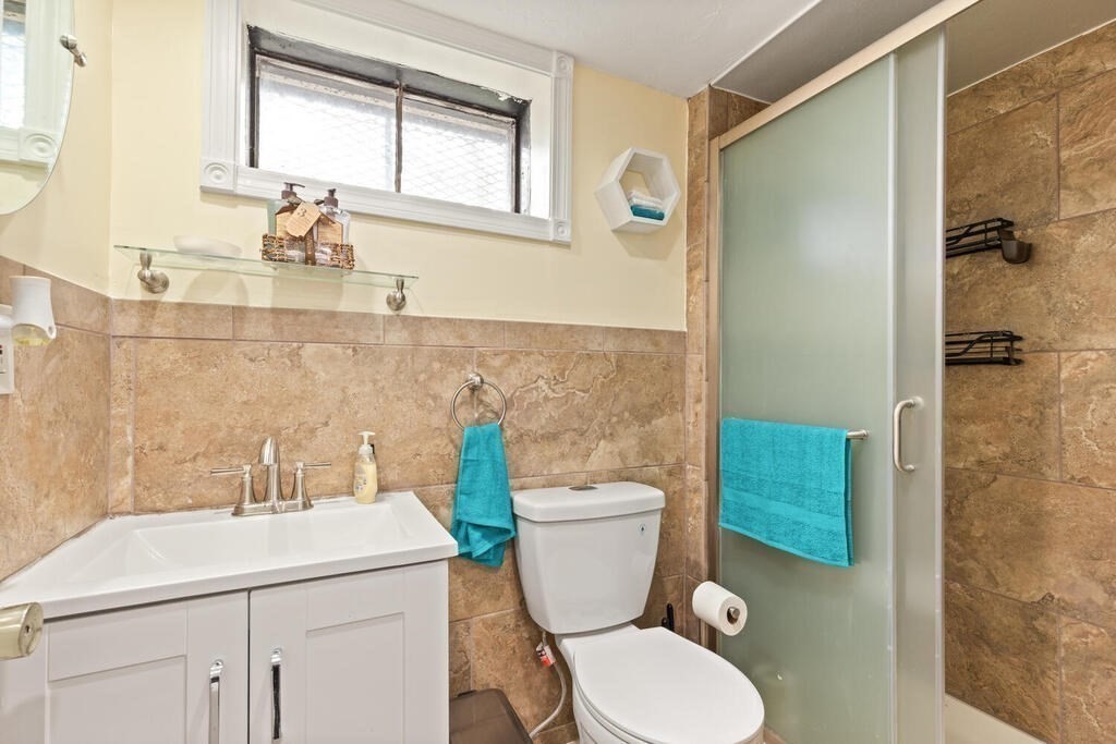 36 Violet Street Boston, MA 02126 - Photo 25 of 35 a bathroom with a sink a toilet and shower