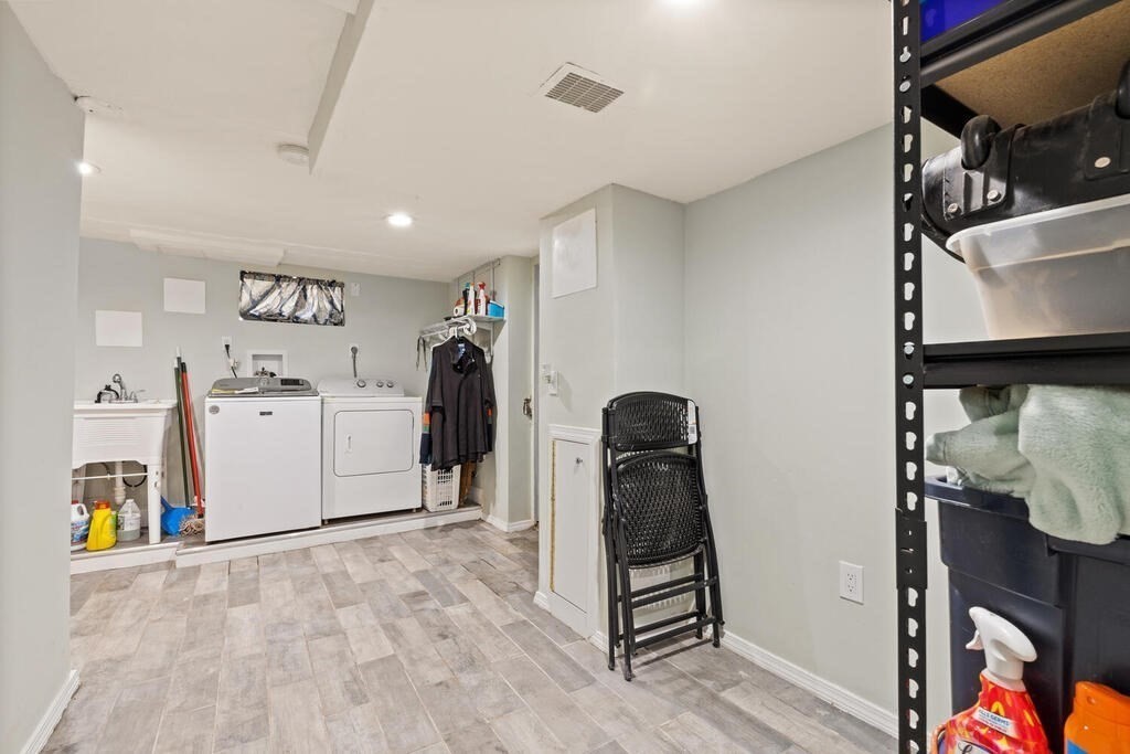 36 Violet Street Boston, MA 02126 - Photo 28 of 35 a view of a storage & utility room with two washing machine