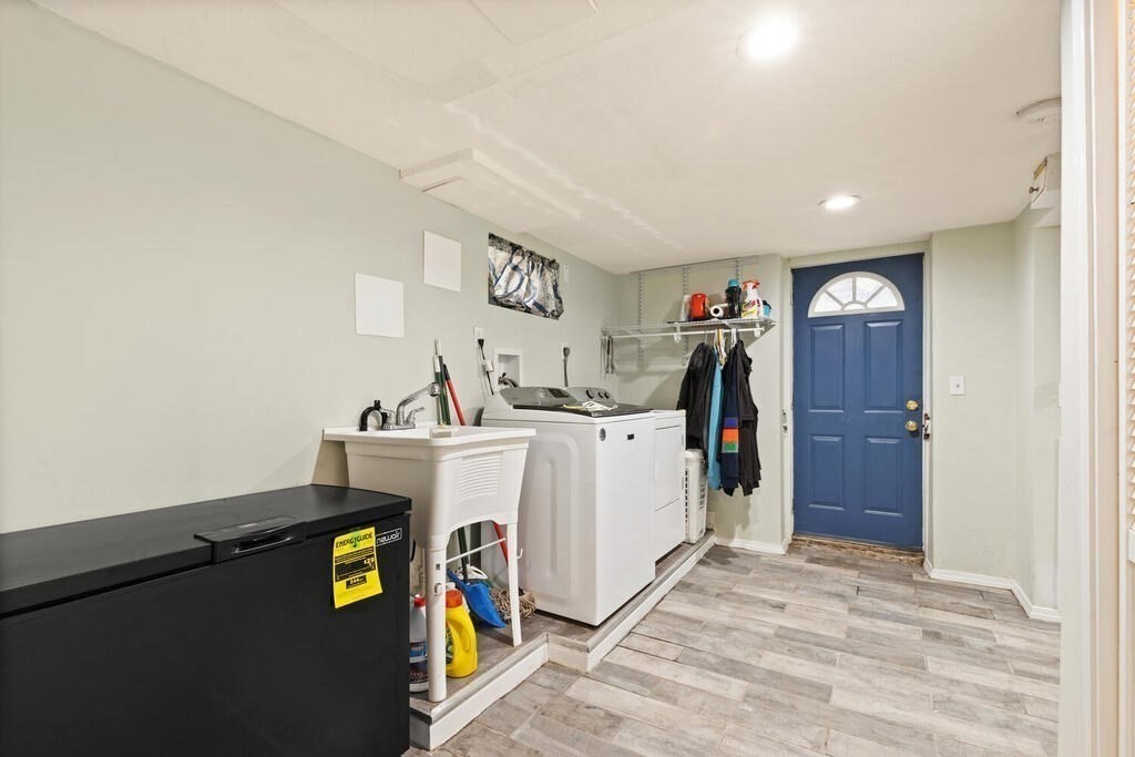 36 Violet Street Boston, MA 02126 - Photo 29 of 35 a view of a storage & utility room with washer and dryer