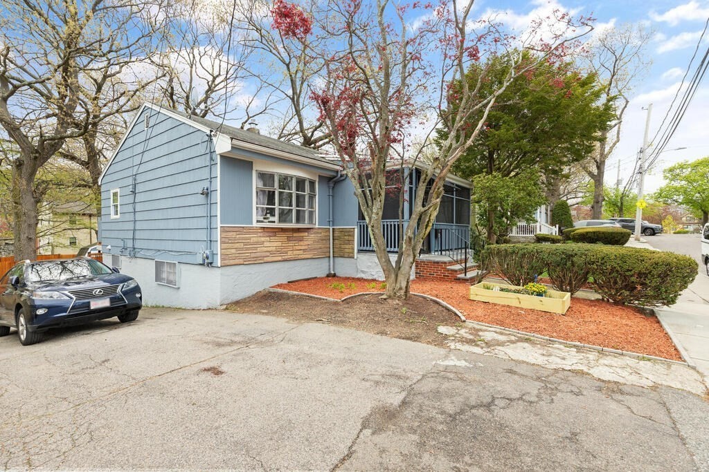 36 Violet Street Boston, MA 02126 - Photo 3 of 35 a car parked in front of a house