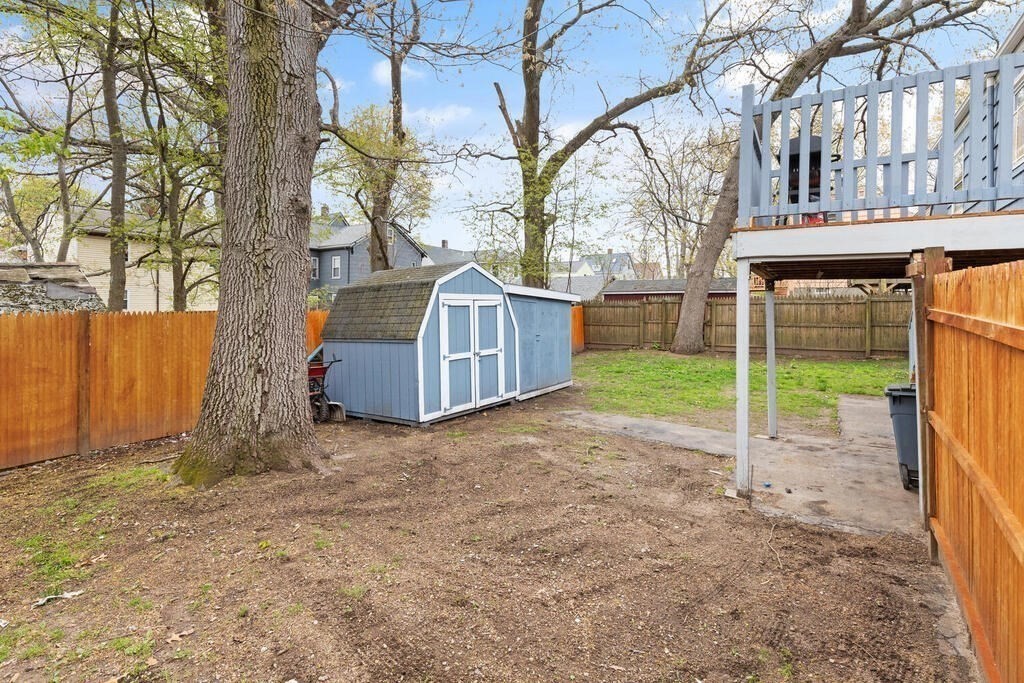 36 Violet Street Boston, MA 02126 - Photo 33 of 35 a view of a house with a yard