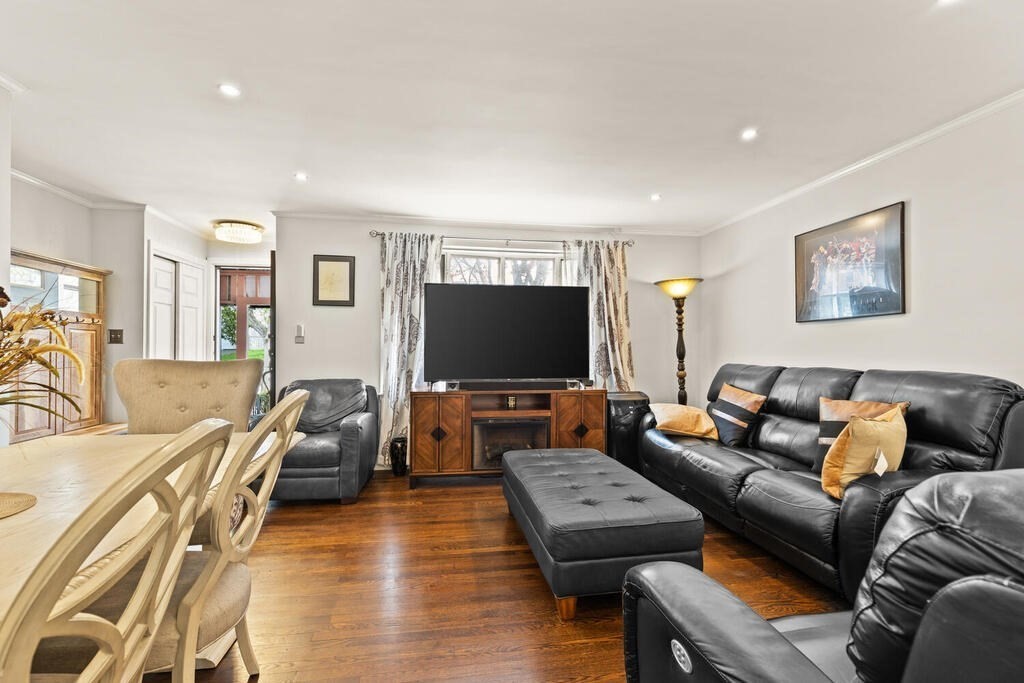 36 Violet Street Boston, MA 02126 - Photo 10 of 35 a living room with furniture and a flat screen tv