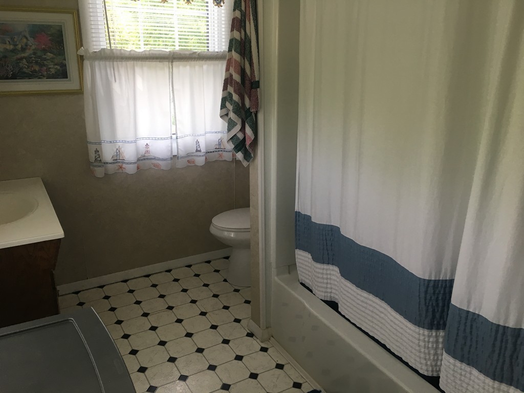 20 Arnold Road Douglas, MA 01516 - Photo 18 of 21 a bathroom with a granite countertop toilet and a sink